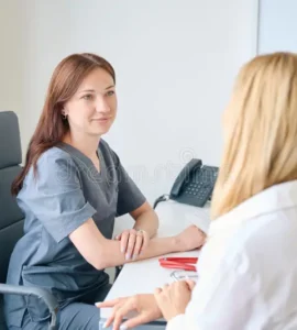 qualified-female-physician-receiving-adult-patient-her-office-lady-doctor-seated-chair-desk-communicating-client-299985272